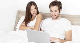 couple in bed on social media